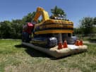 4-person construction obstacle course rental in Austin with excavator bucket feature, ideal for Buda birthday parties.