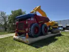 Austin construction truck bounce house rental with working excavator design, perfect for San Marcos birthday celebrations.
