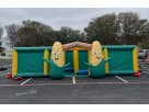 Perfect for Austin parties, this inflatable corn maze rental features a massive teal and yellow structure ideal for all ages.