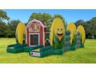 Perfect for fall festivals in Austin, this farm-themed Corn Maze Obstacle Course rental features a red barn and oversized corn