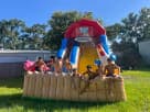 Farm-themed water slide rental in Dallas with dual slides, ideal for kids ages 3 and up at backyard birthday parties in McKinney.