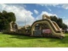 Renta de obstáculos militares de 100ft Boot Camp en Dallas, ideal para entrenamientos en equipo con toboganes duales.