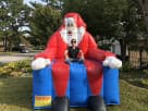 Perfect for Dallas holiday parties, this festive Santa Chair interactive rental features red and blue inflatable design
