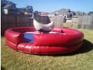 Mechanical bull ride rental in Dallas with blue saddle pad, ideal for Lewisville parties and backyard events.
