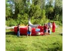 Red bounce house combo with white slide rental perfect for Mesquite outdoor parties with thrills for all ages.