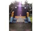 Construction-themed bounce house rental in Dallas with huge jumping area, ideal for kids' parties in Frisco.