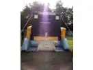 Renta de brincolín con tema de construcción Skid Loader en Dallas — ideal para fiestas infantiles en Frisco con amplia área