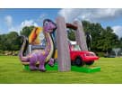 Toddler dinosaur obstacle course rental in Austin with slide, ball pit, and bright purple design—ideal for Pflugerville birthday