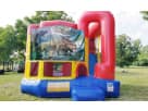 4-in-1 dinosaur bounce house rental in Austin with climbing wall and slide, perfect for Cedar Park kids' parties ages 3 and up.
