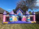 Disney Princess toddler bounce house rental in Dallas backyard with pink and purple castle turrets, ideal for ages 2-6.
