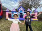 Perfect for Plano toddler parties, this Disney Princess bounce house rental in Dallas features a pink castle with slide