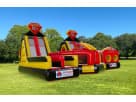 Castle-themed obstacle course rental in Austin with dual slides, ideal for kids' parties in Buda.