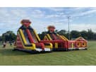 Dual-lane red and yellow obstacle course rental in Austin with climbing challenges, ideal for Round Rock birthday parties