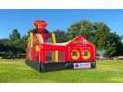 Dual-slide obstacle course rental in Austin with castle towers, perfect for Georgetown birthday parties and competitive racing