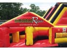 Red and yellow Double Rush obstacle course rental in Dallas with dual lane slides, perfect for kids and adults at McKinney