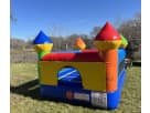 Colorful tiny castle bounce house rental in Dallas with bright yellow, blue, and red turrets—perfect indoor/outdoor option