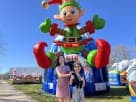 Colorful elf-themed bounce house rental in Austin with mittens and holiday design ideal for Kyle parties.