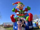 Perfect for Austin Christmas parties, this giant Elf bounce house rental features festive green and red coloring with oversized