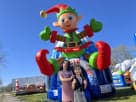 Colorful Christmas elf bounce house rental in Dallas with durable construction, perfect for kids of all ages at outdoor parties