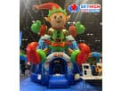 Colorful Elf bounce house rental in Austin with boxing gloves, perfect for kids' Christmas parties in Georgetown.