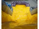 Bright yellow dual-lane water slide rental ideal for Kyle parties, featuring sturdy gray support and blue safety.