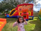 Perfect for Houston Thanksgiving parties, this colorful 3in1 bounce house rental features dual slides and wet or dry play options