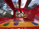 Fire Station bounce house rental with wet or dry slide available in Houston, perfect for Sugar Land birthday parties.