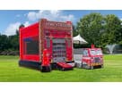 Fire Station bounce house rental with wet or dry water slide option available in Houston, ideal for Kingwood birthday parties.