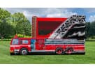 Red and blue firefighter bounce house with attached fire truck cab rental in Houston, perfect for Sugar Land birthday parties