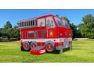 Fire truck bounce house rental in Houston holding 6-8 kids, perfect for fireman-themed birthday parties in Pasadena.