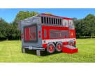 Perfect for Dallas birthday parties, this fire truck bounce house rental features dual slide exits and holds up to 8 kids.