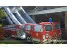 Fire Truck bounce house rental in Austin with dry slide, ideal for Georgetown birthday parties and indoor events.
