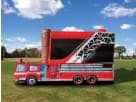 Fire truck bounce house rental in Houston with wet or dry slide — ideal for Cypress birthday parties.