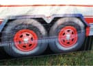 Perfect for Houston parties, this fire truck bounce house rental holds 6-8 kids and features bold red-and-white striped design