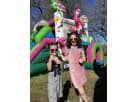 Colorful flamingo bounce house with water slide rental in Houston, perfect for wet or dry backyard parties in Pearland with kids