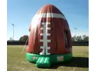 Football bounce house rental in Austin with brown and white laces, holds up to 5 kids, ideal for San Marcos outdoor parties.