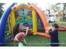 Football-themed bounce house rental in Houston with six interactive games — ideal for Katy birthday parties and family events.