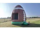 Football bounce house rental in Austin with brown and green design, holds up to 5 kids, ideal for Georgetown outdoor parties.