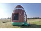Football bounce house rental in Austin with brown and green design, holds up to 5 kids, ideal for Georgetown outdoor parties.