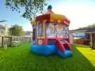 Toy Story 4 Carousel bounce house rental in Houston with red castle tower and slide, ideal for Conroe birthday parties.