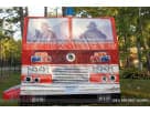 Red and white fire truck bounce house rental in Houston with firefighter cab windows, ideal for Pearland parties.