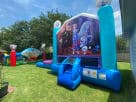 Frozen 2 bounce house with dual slides in Dallas backyard rental—wet or dry slide, ideal for Fort Worth parties.