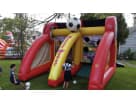 Perfect for Irving birthday parties, this soccer-themed bounce house rental in Dallas features dual slides and interactive