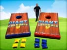 Perfect for Dallas team building events, this giant cornhole rental features 5-foot boards with blue and red finishes