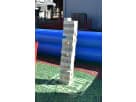 Giant Jenga lawn game rental setup in Dallas with oversized wooden blocks between blue inflatables, ideal for Garland backyard