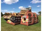 Military tank obstacle course rental in Austin with rock wall and slide, perfect for Pflugerville events.