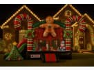 Perfect for Austin holiday parties, this Christmas gingerbread bounce house rental features illuminated candy cane decorations