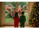 Kids looking out window and seeing a Gingerbread Bounce House Combo Christmas Bounce House