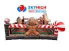 Gingerbread Playland bounce house rental in Dallas with festive red and white candy cane décor, ideal for Plano parties.