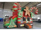 Perfect for holiday parties in Austin, this Christmas gingerbread bounce house rental features candy cane columns and gift box